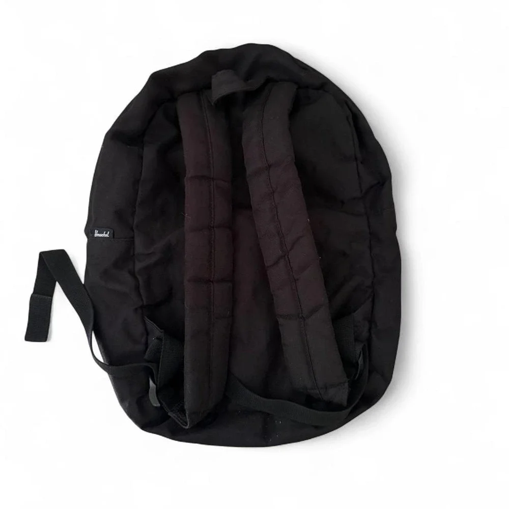 Herschel black backpack with red and white striped interior